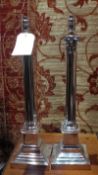 A pair of silver plated Corinthian column table lamps.