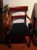 A 19th century mahogany elbow chair with bar back and scrolling arms,