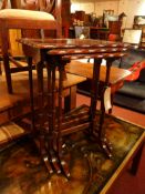 An Edwardian mahogany nest of three tables with makers label 'Allan and Appleyard'.