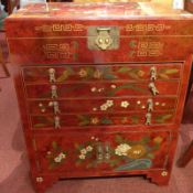 A Chinese red lacquer and chinoiserie cutlery cabinet the hinged top above arrangement of drawers