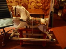 A Victorian painted childs rocking, horse with tartan saddle and horse hair mane.