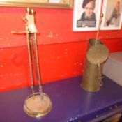 A Victorian brass coal scuttle together with other fireside tools.