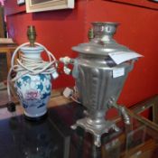 A pair of Oriental porcelain table lamps decorated with peonies together with a silver plated