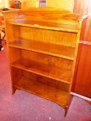 A mid 20th century oak open bookcase with adjustable shelves.