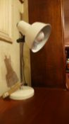 A retro 1950's desk lamp with white enamelled shade and base.
