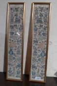A pair of Chinese glazed and gilt framed embroidery panels depicting various flowers and vases.