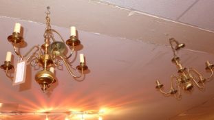 A set of three five branch brass Christopher Wray chandeliers.