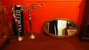 A 19th century oak wall mirror with oval bevelled plate together with a Victorian brass hanging