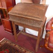 An 18th century and later oak bible box with sloped rising lid revealing fitted interior,