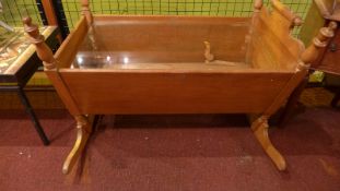 A French fruitwood crib / coffee table with plate glass top.