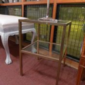 A pair of 20th century brass square form two tier occasional tables with inset glass shelves.
