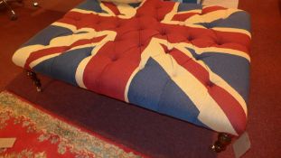 A large rectangular stool upholstered in buttoned Union Jack fabric on turned supports and brass