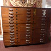 A mid 20th century mahogany bank of drawers fitted with thirty nine hand numbered drawers with