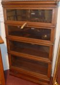 A 19th century oak Globe Wernicke bookcase of four sections with glazed panel doors and base drawer.