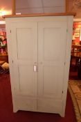 A green painted pantry cabinet the panelled doors enclosing beech interior above pair of base