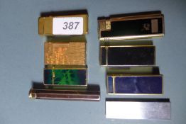 Two Dunhill lighters and six other similar lighters