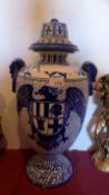 An antique Eastern blue and white vase of large proportions with shield and eagle detail.
