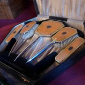 An Art Deco four piece enamel, chrome and horse hair brush set,