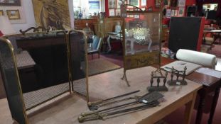 A brass and bevelled glass fire guard with foliate cut detail together with a collection of