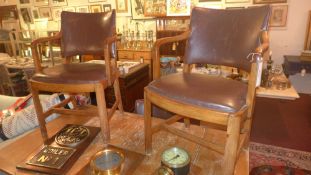A set of four 1930's Heal's oak dining chairs including two carvers together with a similar oak