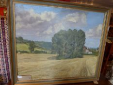 A 20th century oil on canvas country landscape with wheatfields and a farmhouse in the distance,