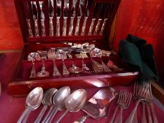 A canteen of Queens pattern silver plated cutlery and a collection of similar flatware.