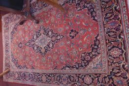 A fine central Persian Kashan rug 220cm x 125cm central double pendant medallion surrounded flower