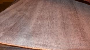A contemporary thick pile grey rug 230 x 160cm.