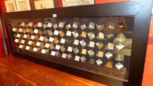 A large glazed and framed three dimensional study of coloured bricks at different angles 160 x 60cm