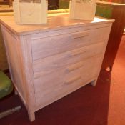 A contemporary bleached solid oak chest fitted four long drawers and raised on square section