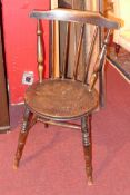 A 19th century elm and oak country chair with stickback and solid seat raised on turned stretchered