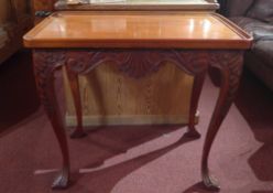 A Chippendale style mahogany silver table raised on cabriole supports.