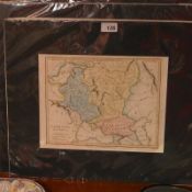 A collection of mounted maps of the world, hand tinted.