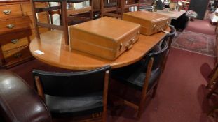 A McIntosh teak extending dining table with two extra leaves (seats ten when extended).