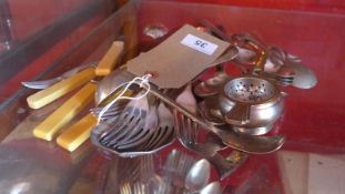 A collection of silver plated items including flatware.