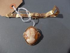 A 9ct gold ladies bracelet together with a 9ct gold cameo brooch with portrait of a lady in relief.