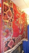A fine north west Persian Bakhtiar rug 220cm x 130cm central floral medallion on a rouge field