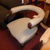 A Victorian carved walnut bedroom chair with hooped back and upholstered in pale seafoam green