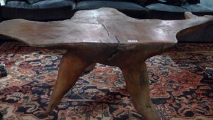 A rustic tree root occasional / coffee table.