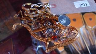 A collection of Edwardian and later necklaces including rolled gold examples.