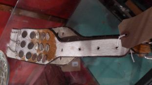 An Argentinian Gacho belt made with cow hide and Argentinian coins with horseshoe design.