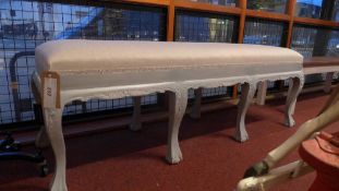 A French style painted window seat upholstered in linen fabric and raised on cabriole ball and claw