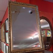 A gilt framed wall mirror with bevelled plate.