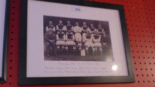 A framed print of a photograph of the Arsenal FA Cup winners 1936 together with portraits of