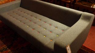 A contemporary designer 'Portion' three seater sofa by Naughtone upholstered in grey fabric and