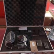 A vintage Pentax camera in case with lenses and accessories together with a collection of other