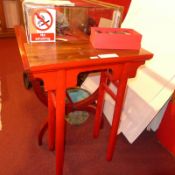 A Chinese hardwood and painted ceremonial tea table raised on turned supports together with the