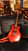 A Hondo red lacquered electric guitar (Les Paul copy)