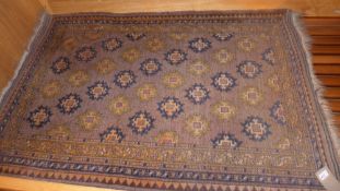 A Persian rug the brown field having geometric motifs in a multiborder.