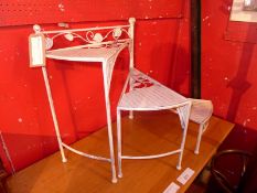 A wrought iron white painted spiral step form garden plant stand